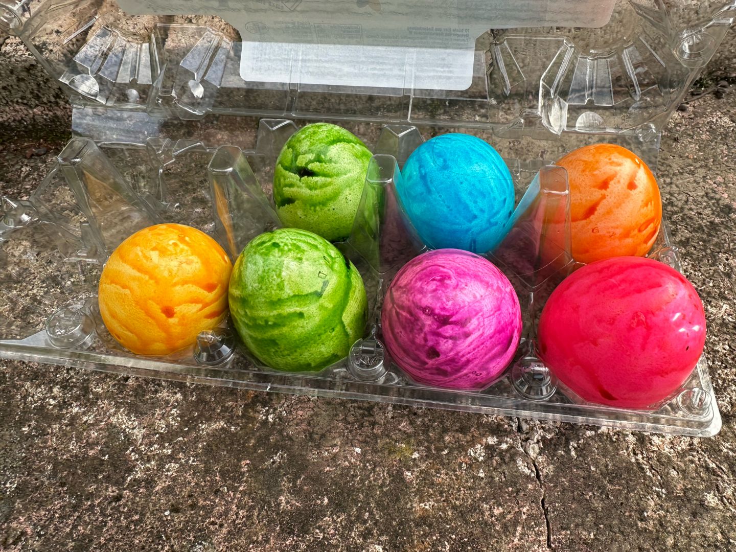Seven coloured chicken eggs in a plastic case…